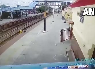 Woman narrowly misses being hit by a train