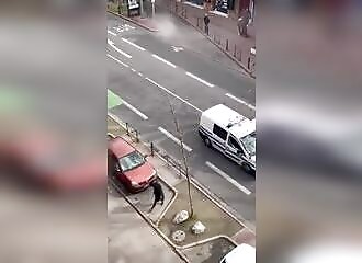 A transvestite in Toulouse throws his shoe at police officers