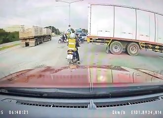 A woman survives an impressive accident when a truck tips over on top of her