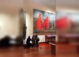 Environmental activists throw paint on Columbus painting in Madrid