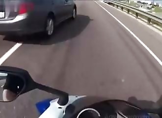 A motorist suddenly changes lanes and violently collides with a motorcyclist