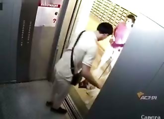 Her muzzled dog lunges at two men in the elevator; she smiles without intervening