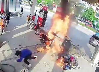 A motorist hits a petrol pump as he tries to park
