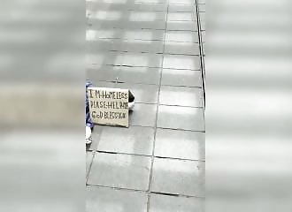 He rips and tears down the sign of a suspected fake beggar in Rotterdam