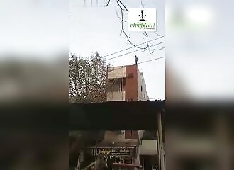 Man falls from building and attacks police with bricks
