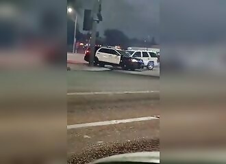 A Los Angeles police officer shoots a madman who hits him with his car