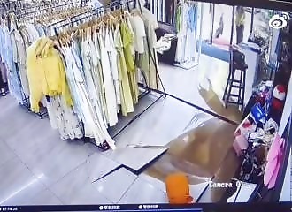 Underground water pipe bursts in clothing store