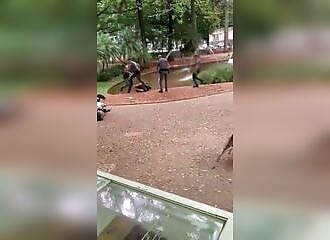 A runaway is kicked several times after surrendering to police