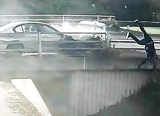A motorcyclist gets hit and flies through the air during a roadrage