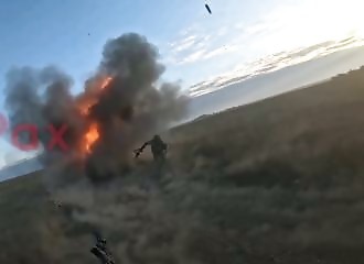 Russian soldiers narrowly avoid being hit by a Ukrainian drone