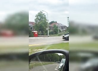 In the Netherlands, he has himself driven around while lying on the hood of a car