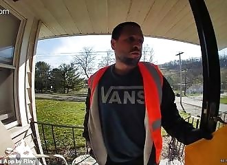  Burglar disguised as a package delivery man holds up a homeowner 