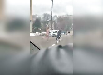  A naked woman chases a policeman, his colleagues laugh 