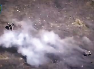 A Russian soldier fends off a Ukrainian drone with his submachine gun! 