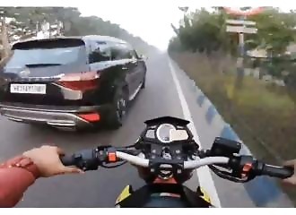 A biker grumbles at a motorist, karma calls him to order