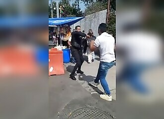 A policeman accepts a 1-on-1 fight with a civilian during a dispute