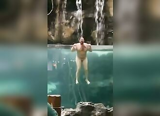 He dives naked into the pool of a fishing store after a car crash