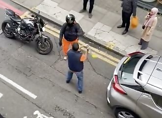 He hits a biker with a lock and gets destroyed in return