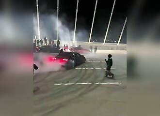 They block traffic on a bridge and attack motorists
