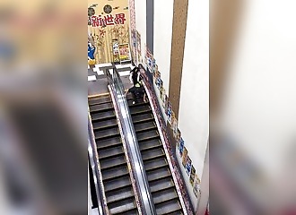 Japan: A saleswoman chases a thief down an escalator