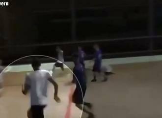 A player knocks out a referee with a punch from behind