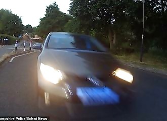A fleeing policeman collides with a motorcyclist during a chase