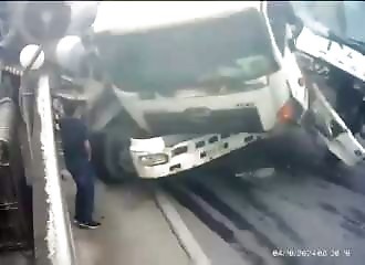  He finds himself in the middle of an accident between two trucks and miraculously survives 