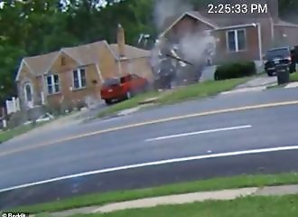 A woman dies and nearly kills a child when she plows into a house at 160 km/h