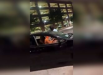 A wild naked man steals a car and knocks down its owner