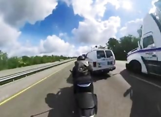 This motorcyclist speeds through traffic and ends up colliding violently with a vehicle