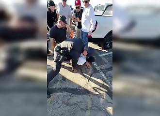 He jostles an American police horse, and the aftermath is brutal.