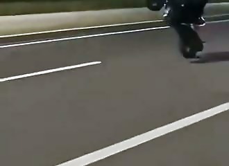 Nighttime motorcycle fail: a wheelie that ends on the pavement
