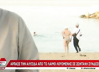 A lady is robbed on the beach during a live report