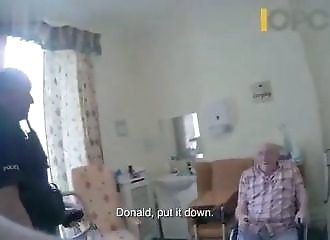 A policeman tases a wheelchair-bound senior citizen who refuses to drop a knife 