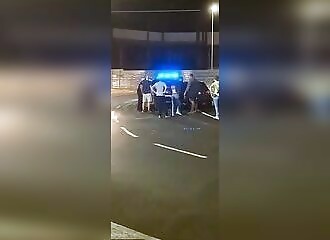  A man forces traffic to stop by driving against the flow of traffic on a traffic circle 