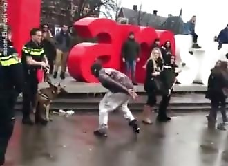 A man tries to scare off a police dog, then uses his leg as a meal