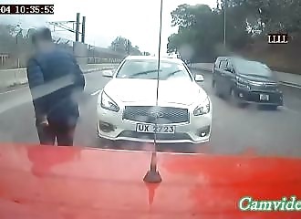 Stopping for a chat in the middle of a fast lane is a bad idea