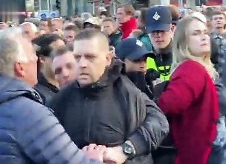 Two people arrested after shouting Free Palestine at a commemoration for the dead