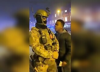 he harasses a police officer (or a soldier?) and quickly pays him off