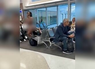 Passenger strips during airport clash