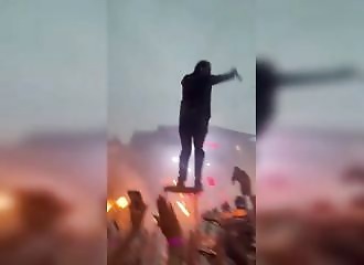A singer launches himself into the audience, but no one catches him