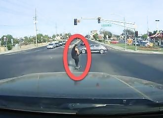 A guy on a scooter runs a red light and pays for it instantly