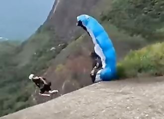 Fatal accident for skydiving instructor jumping off cliff edge (Warning - shocking)