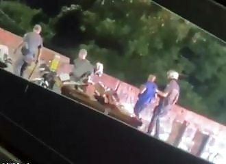 A delivery driver is thrown off a bridge by a policeman during a traffic stop in Brazil