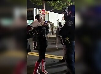 A protester refuses to back down when ordered to do so by a police officer - and pays dearly for it!