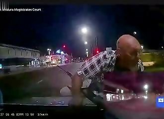 Crazy biker gets caught on car hood, motorist takes him straight to the police station