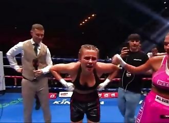 Boxer shows off her breasts after winning her match