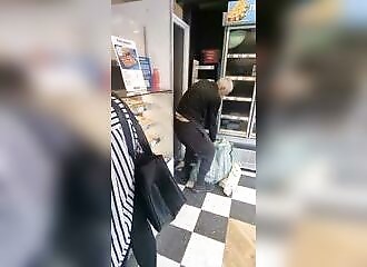 Shock: a thief completely robs a Greggs bakery as everyone watches in amazement