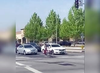 A homeless woman mistakes her trolley for a car