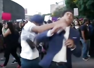 Little bastard punches a reporter from behind!